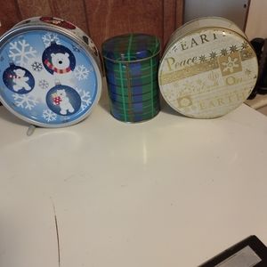 THREE ASSORTED CHRISTMAS TINS WITH LIDS.